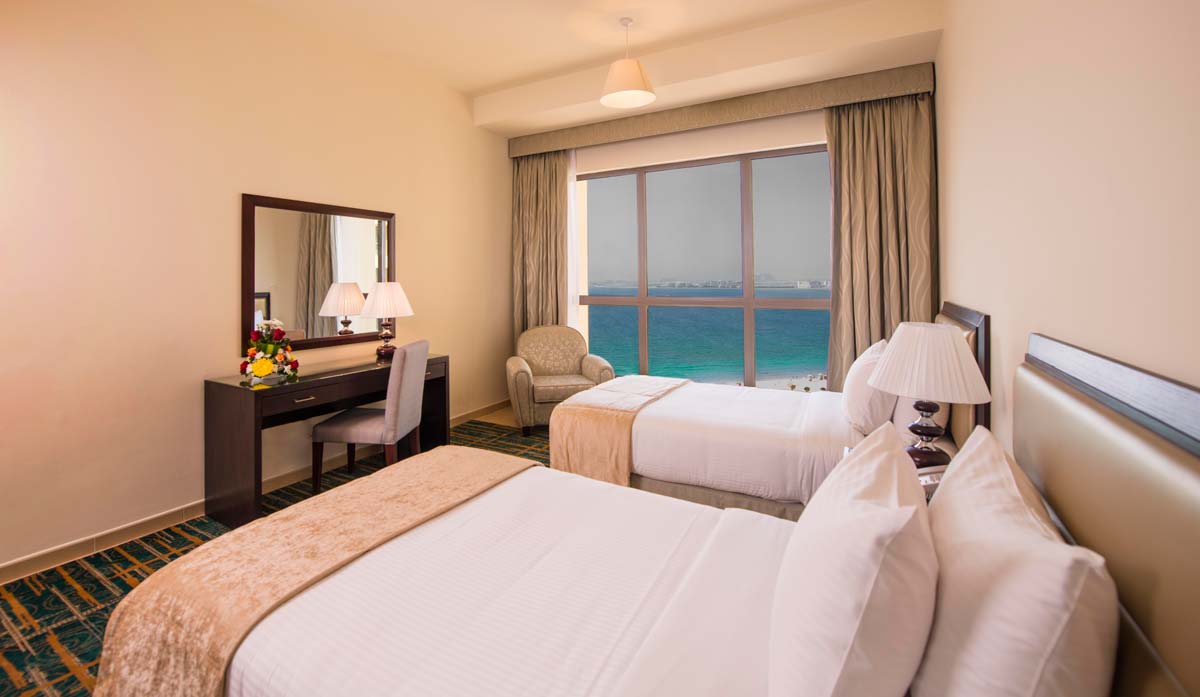 Our simple yet spacious twin bedrooms with stunning views of the JBR Beach and Marina